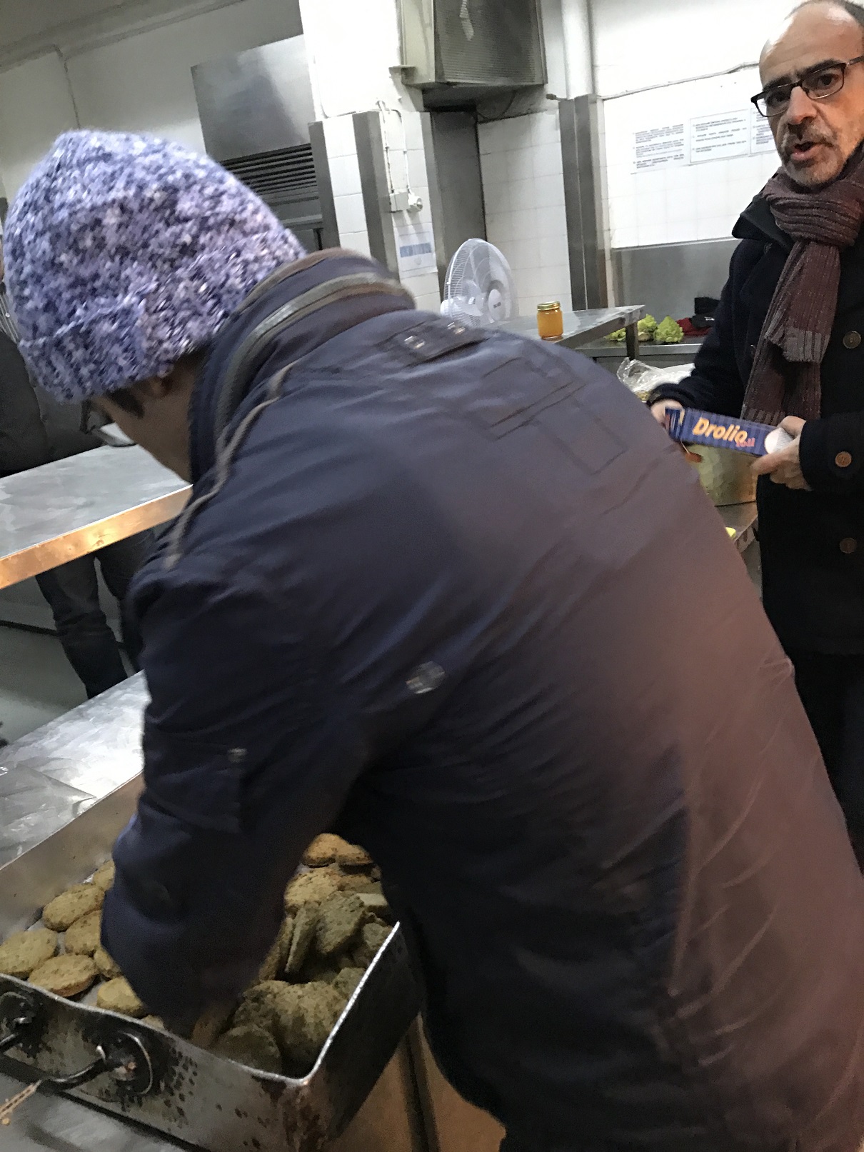 Rostom cooks for other refugees with us 